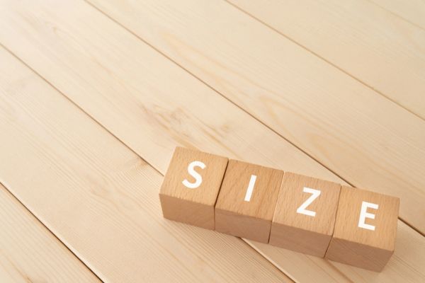SIZE spelled using wooden letter cubes depicting propane tank