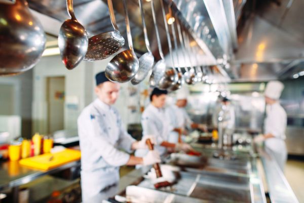restaurant chefs in a modern industrial kitchen