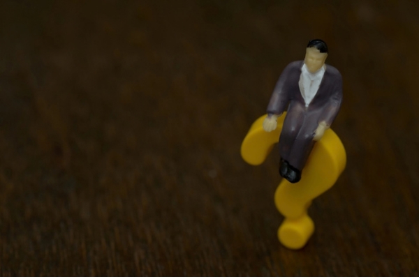 3D plastic question mark with miniature man on top depicting Propane Preparation Tips FAQs