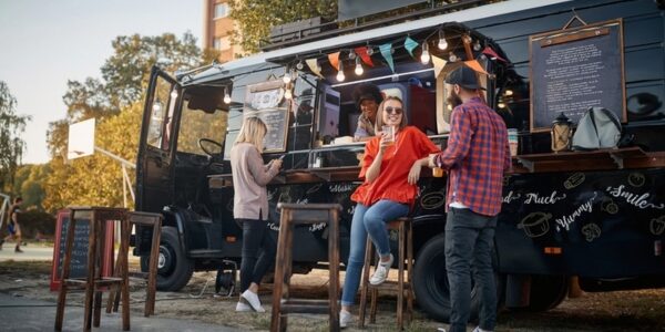 food truck with customers and chairs outside
